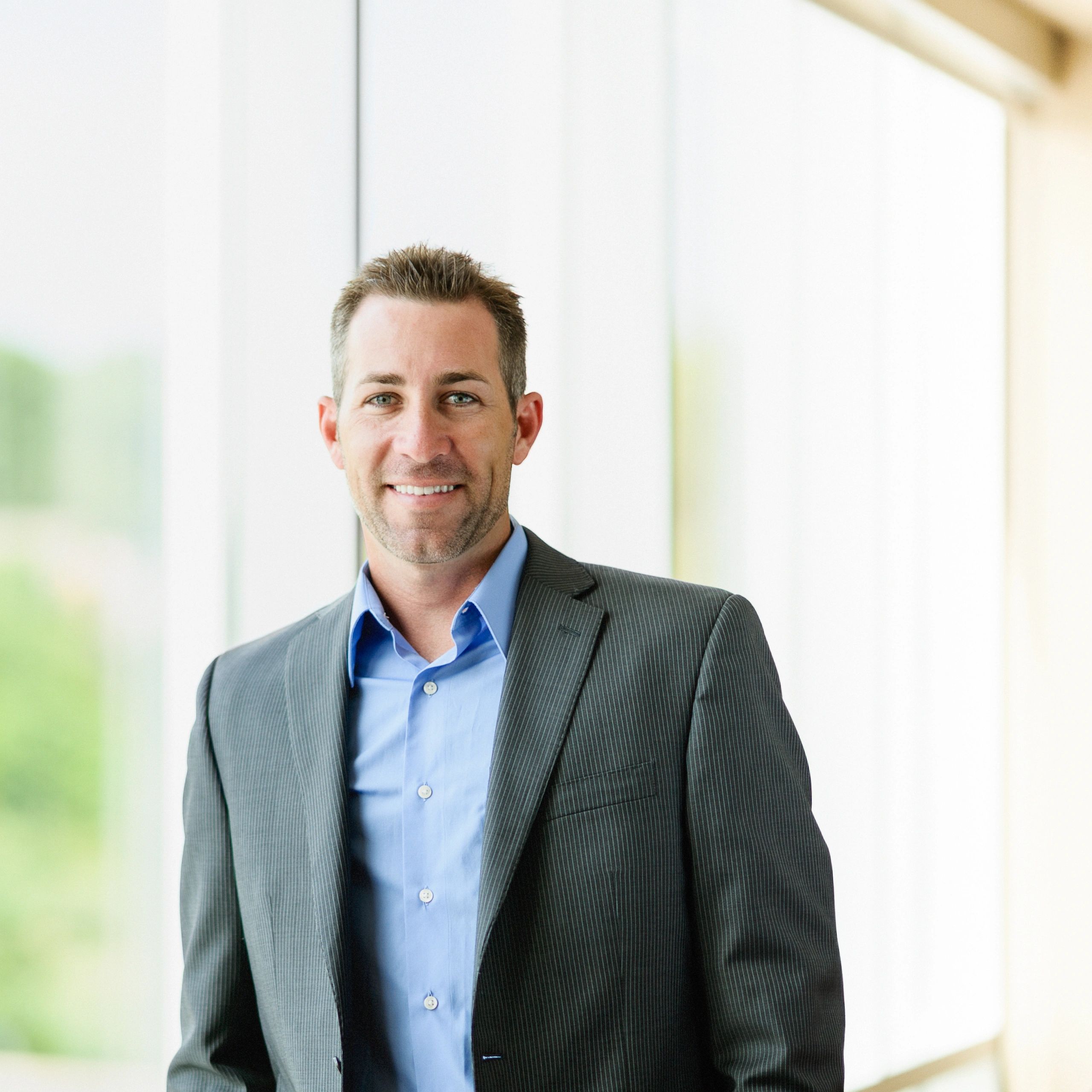 Professional portrait representing company leadership